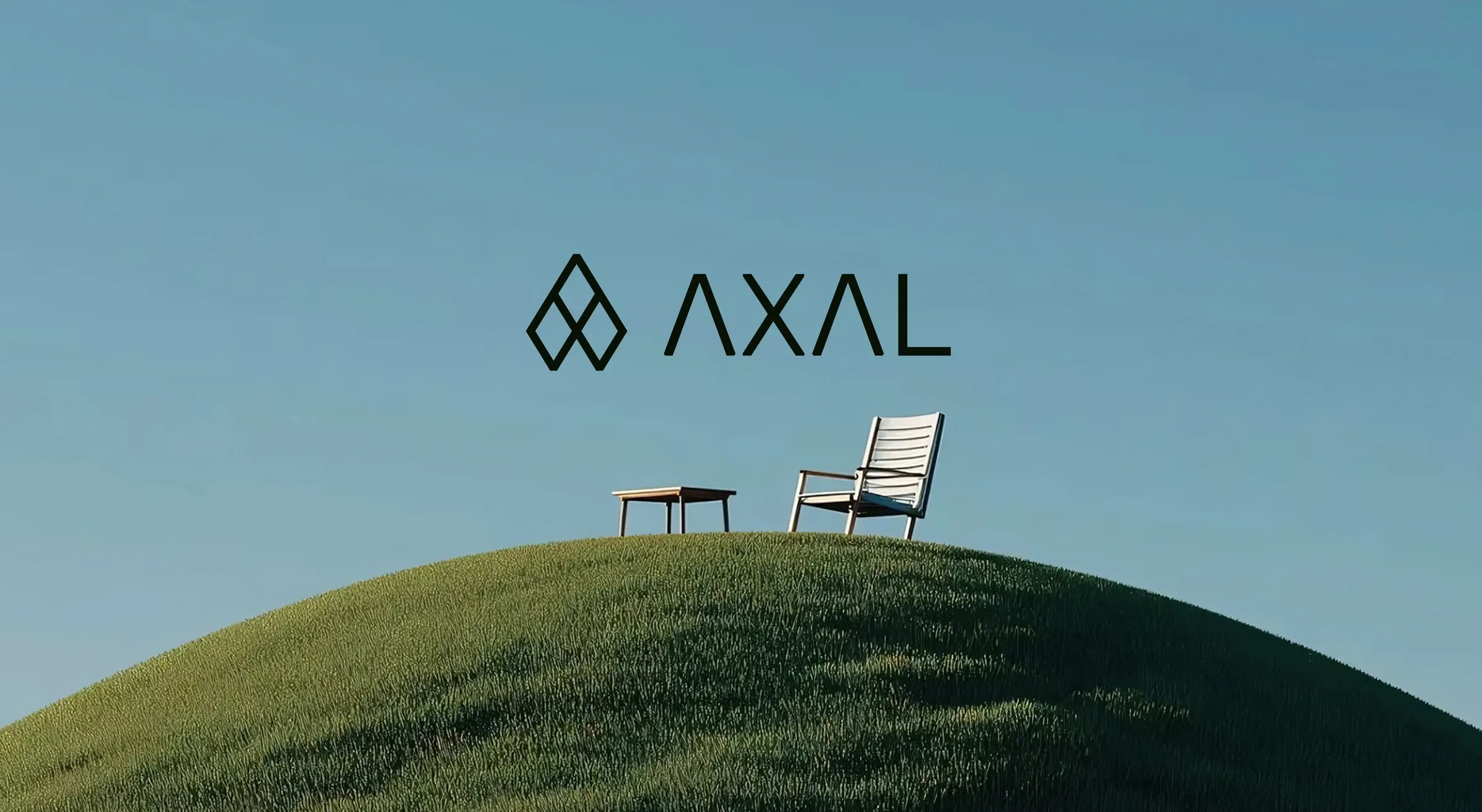 Axal logo above a white chair and table on a grassy hill under a clear sky