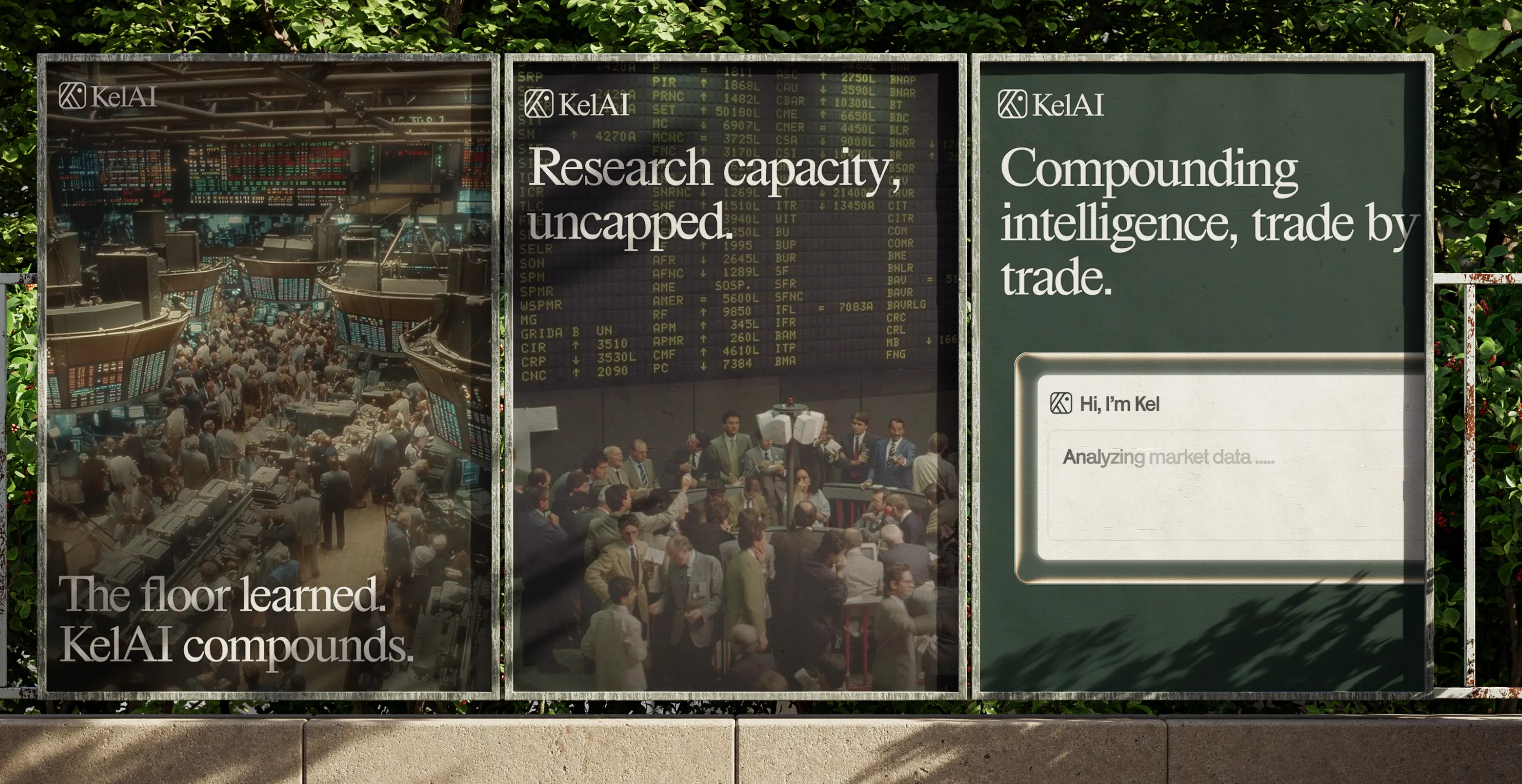 KelAI campaign posters on an outdoor wall: “The floor learned. KelAI compounds.” and “Research capacity, uncapped.”